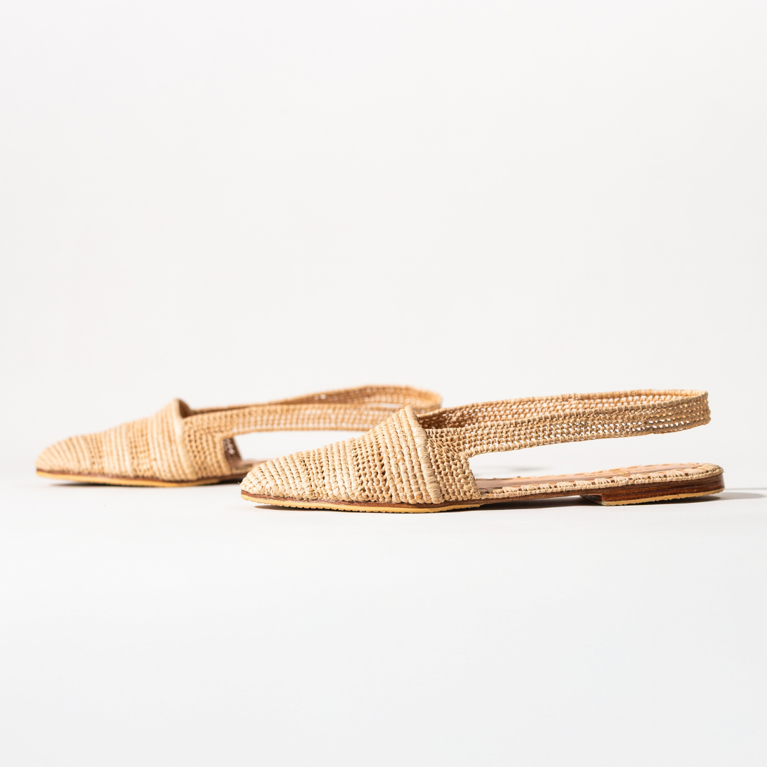 Amaynu flats in profile, showing the open back and flat leather sole