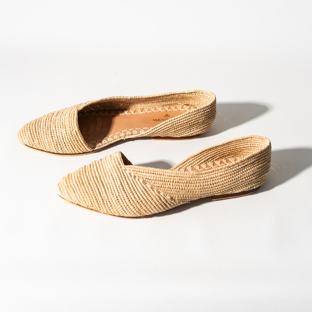 Ayyur flats in profile, showing the open side cut and flat leather sole