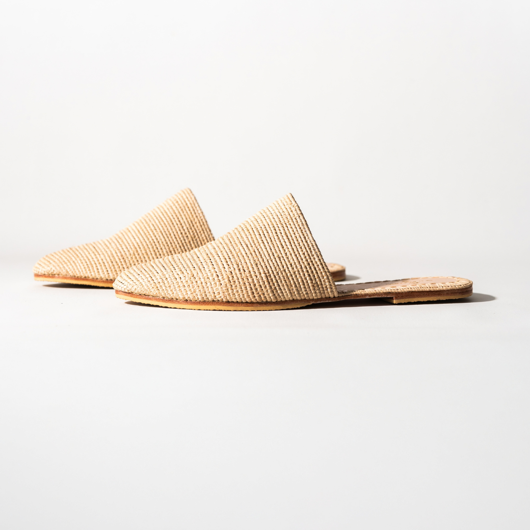 Babouche slip-ons in profile, showing the pointed toe and flat leather sole