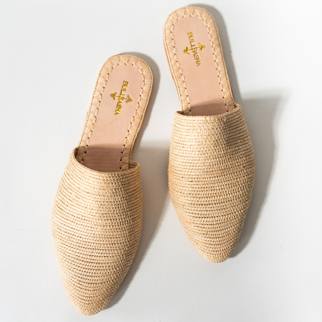 Babouche slip-ons in natural beige, handwoven tropical tree fiber seen from above