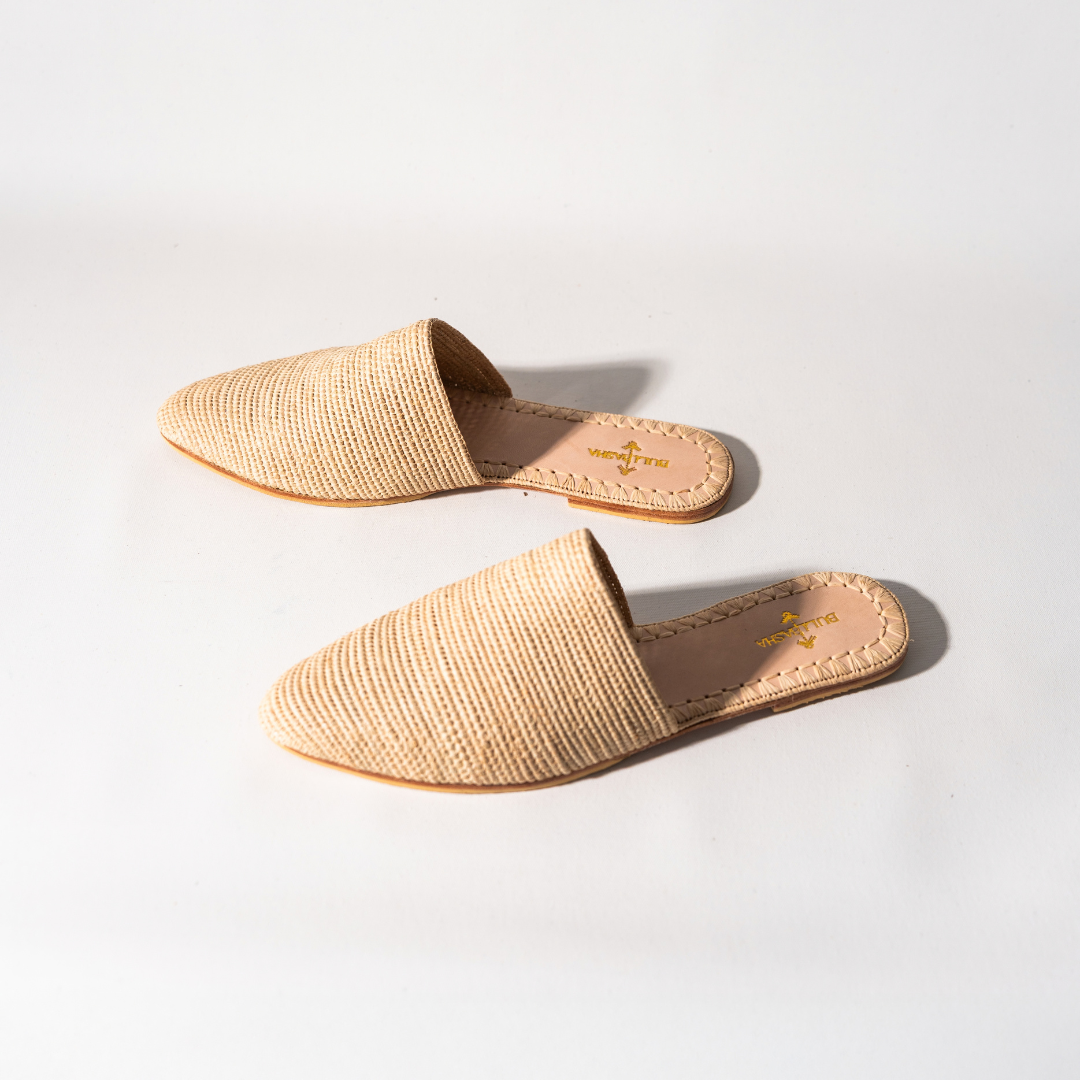 Babouche slip-ons angled, one turned to show the woven side and backless heel